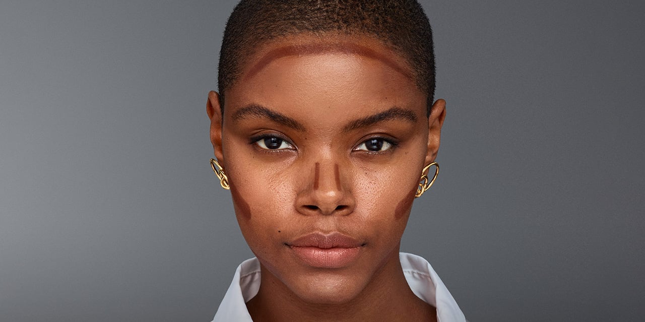 Tutorial showing how to contour on a dark skin tone using cream concealer